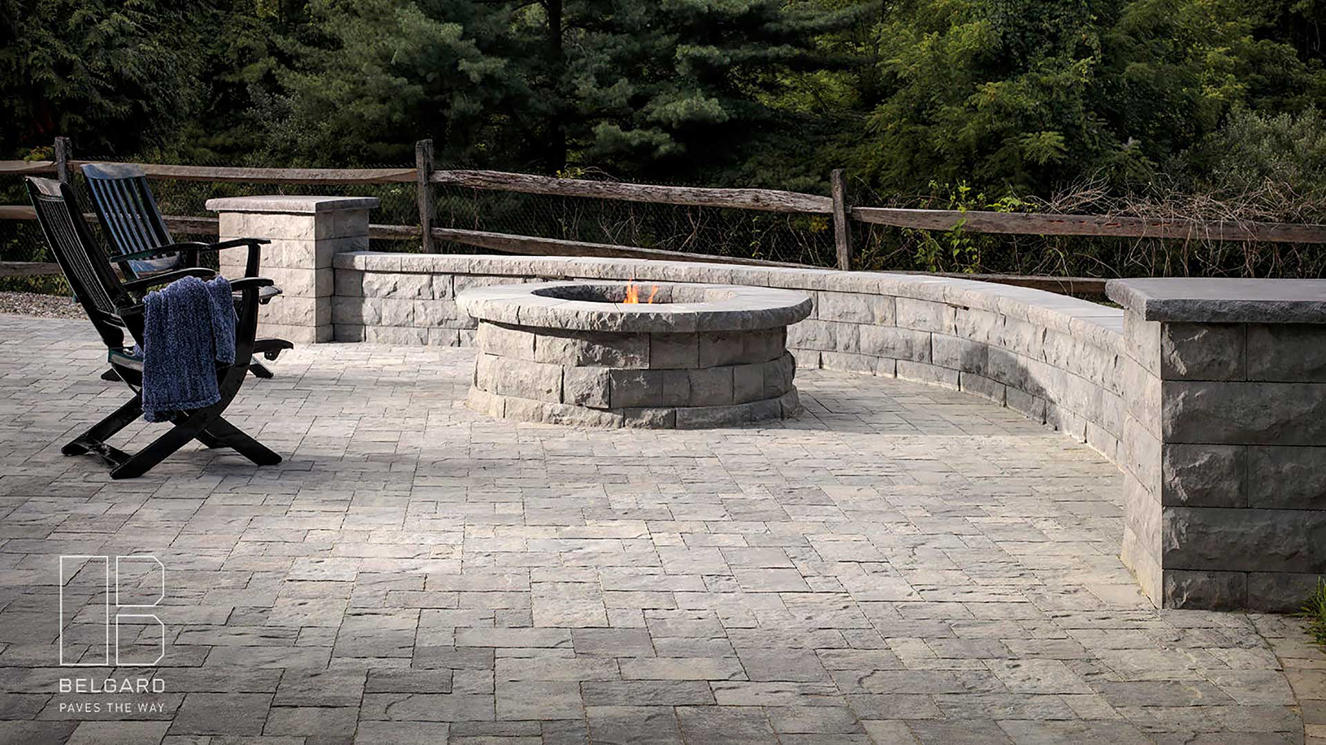 Belgard paver patio and fire pit with seating walls and chairs in Clinton, NJ.