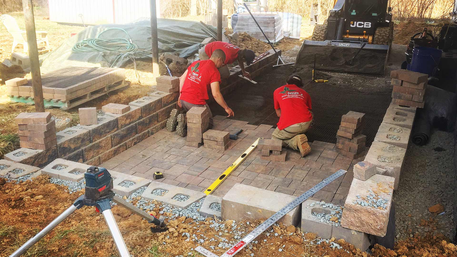 Landscape experts installing a paver patio in Clifton, NJ.