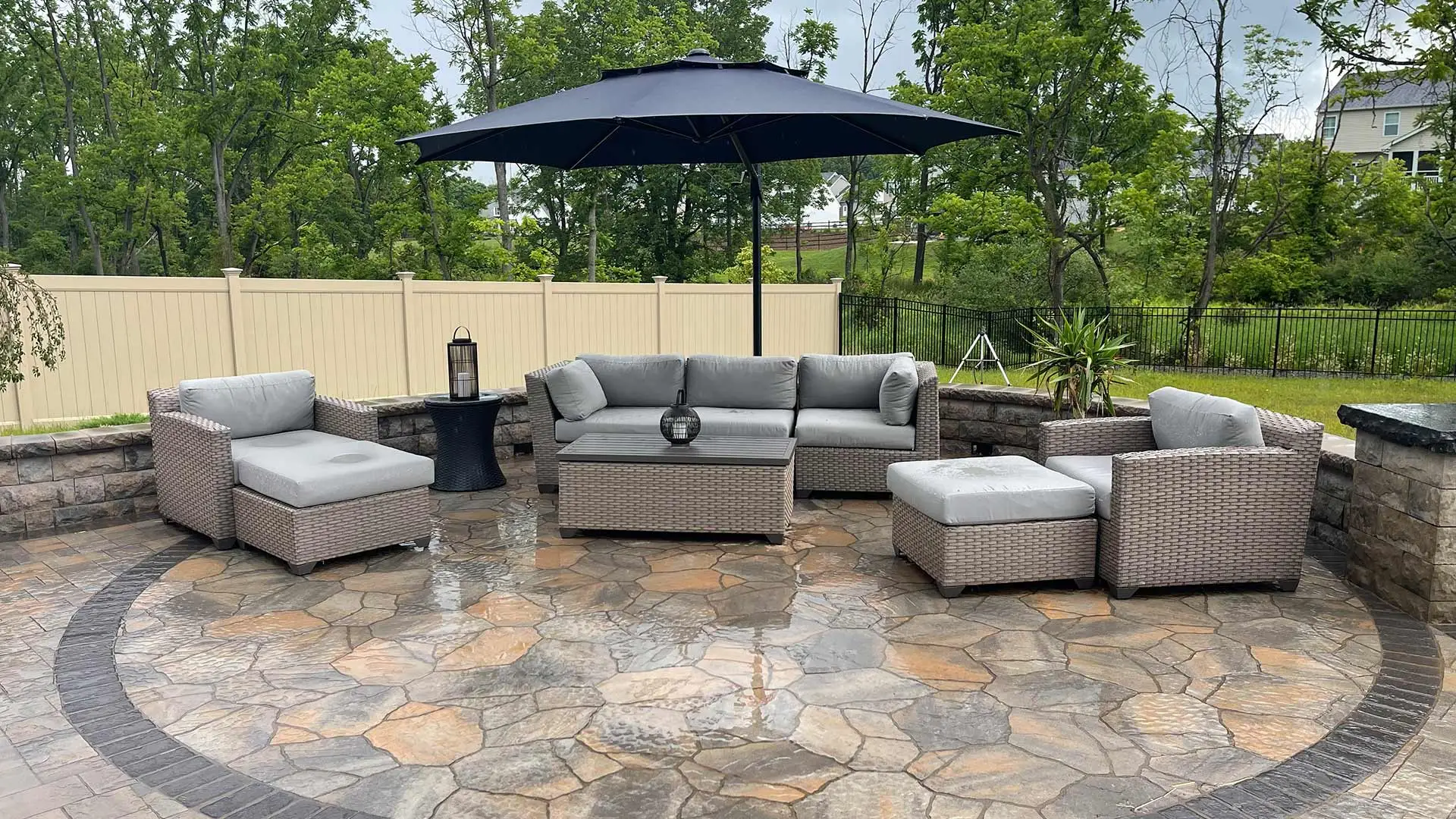 Custom outdoor patio with seating and umbrella near Easton, PA.