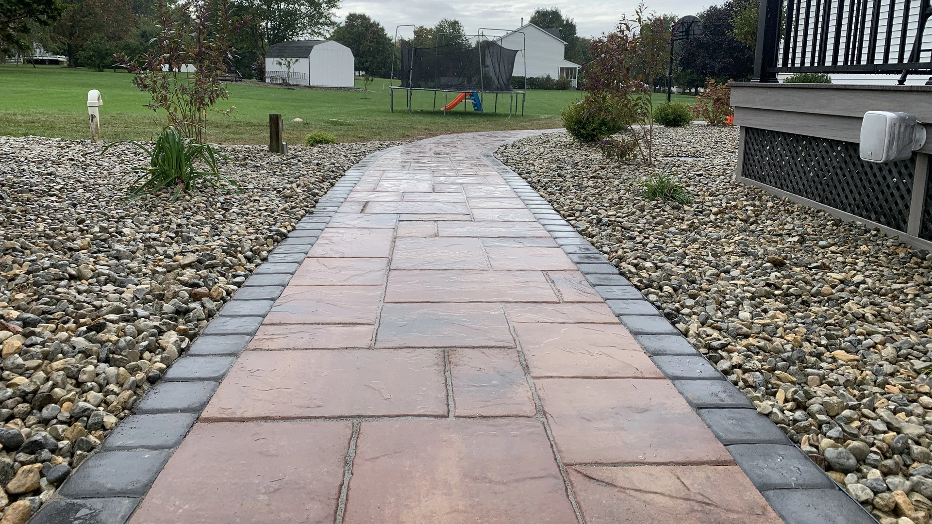 A custom built walkway surrounded by rocks in our client's backyard in Bethlehem, PA.