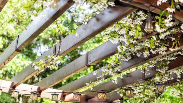 Pergola installed with dainty flowerings wrapped around roof in Bethlehem, PA.