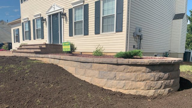Retaining wall for front lawn softscape installed in Clinton, NJ.