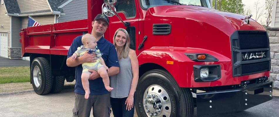 Trevor and his family posed in front of a red work truck in Easton, PA.
