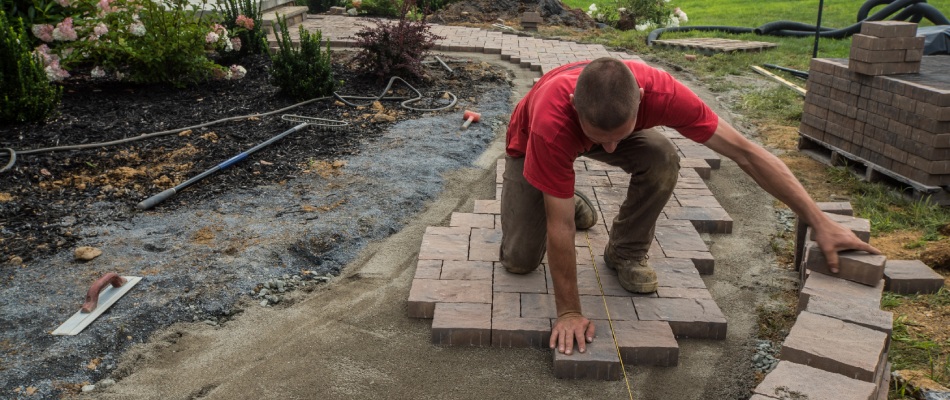 Trevor's professional adding pavers for walkway build in Califon, NJ.