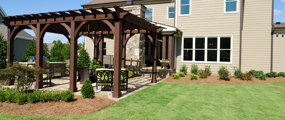 A wooden pergola installed on a patio in the backyard of our client's home in Califon, NJ.